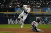 Arizona Diamondbacks' Jake McCarthy (30) steals second base as Chicago White Sox second baseman Romy Gonzalez, left, takes a late throw during the eighth inning of a baseball game, Saturday, Aug. 27, 2022, in Chicago. (AP Photo/David Banks)