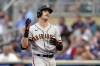 San Francisco Giants' Mike Yastrzemski reacts after striking out against the Minnesota Twins during the first inning of a baseball game Saturday, Aug. 27, 2022, in Minneapolis. (AP Photo/Abbie Parr)