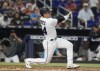 Miami Marlins' Nick Fortes (54) breaks a bat on a hit in the second inning of a baseball game against the Los Angeles Dodgers, Sunday, Aug. 28, 2022, in Miami. (AP Photo/Marta Lavandier)
