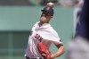 Boston Red Sox's Nick Pivetta winds up for a pitch against a Boston Red Sox player in the first inning of a baseball game, Sunday, Aug. 28, 2022, in Boston. (AP Photo/Steven Senne)