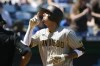 San Diego Padres' Manny Machado reacts at home plate after hitting a home run during the fifth inning of a baseball game against the Kansas City Royals in Kansas City, Mo., Sunday, Aug. 28, 2022. (AP Photo/Colin E. Braley)