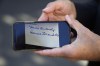French Emergency Doctor Frederic Maillez, who was first to arrive at the scene of the crash that killed Britain's Diana, Princess of Wales, displays a copy of the letter he received from Diana's mother, during an interview with The Associate Press, next to the Pont de l'Alma tunnel, in Paris, Wednesday, Aug. 24, 2022. It has been nearly 25 years since Princess Diana died in a high-speed car crash in Paris. The French doctor who treated her at the scene has recounted what happened. Dr. Frederic Mailliez told The Associated Press how he tried to save her on that night of Aug. 31, 1997. (AP Photo/Francois Mori)