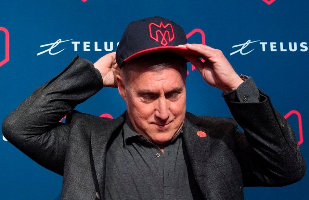 Gary Stern the new co-owner of the Montreal Alouettes tries on a cap following a news conference in Montreal, Monday, January 6, 2020. THE CANADIAN PRESS/Graham Hughes