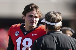 FILE - Georgia quarterback JT Daniels (18) talks with head coach Kirby Smart in the second half of an NCAA college football game against Charleston Southern, Saturday, Nov. 20, 2021, in Athens, Ga. Daniels transferred to West Virginia from national champion Georgia, where he lost his starting job last season. (AP Photo/John Bazemore, File)