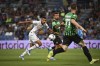 Sassuolo's Martin Erlic fights for the ball with Milan's Junior Messias during the Serie A soccer match between Sassuolo and Milan at Mapei Stadium, Reggio Emilia, Italy, Tuesday Aug. 30, 2022. (Massimo Paolone/LaPresse via AP)