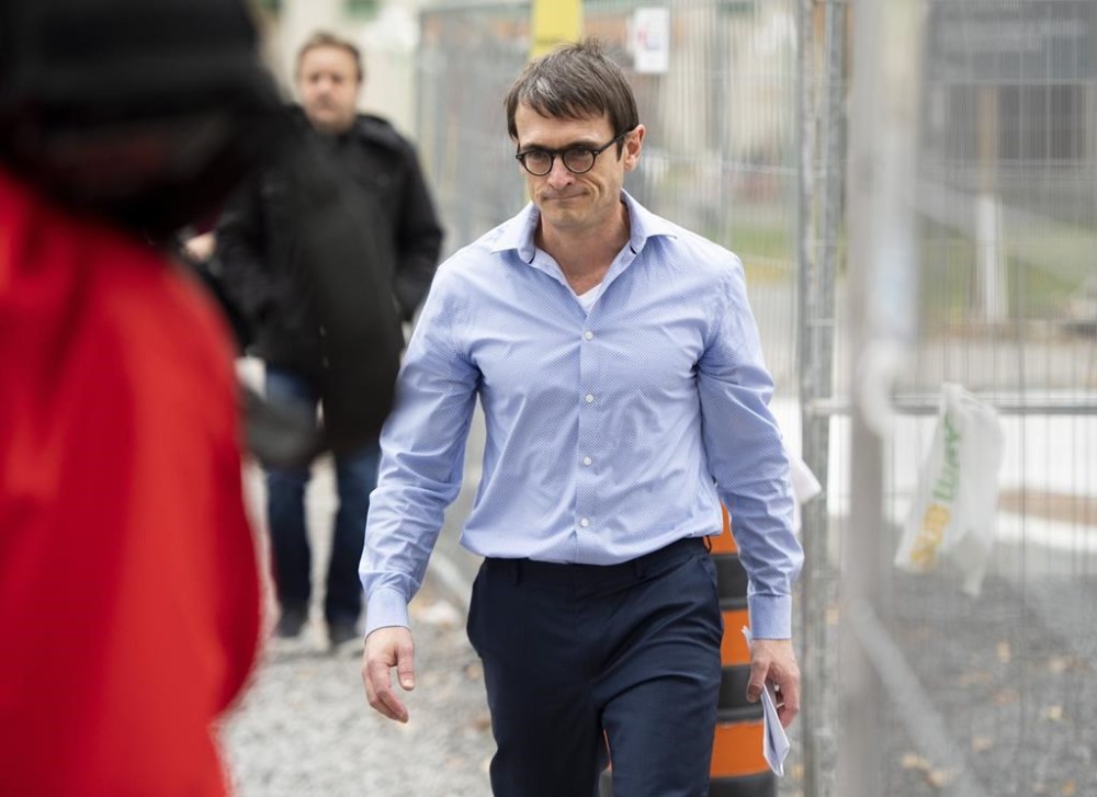 Cameron Ortis, a senior intelligence official at the RCMP, leaves the courthouse in Ottawa after being granted bail on October 22, 2019. THE CANADIAN PRESS/Justin Tang