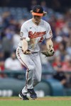 Baltimore Orioles third baseman Gunnar Henderson fields the ball and throws out Andres Gimenez at first base in his Major League debut during the sixth inning of a baseball game Wednesday, Aug. 31, 2022, in Cleveland. (AP Photo/Ron Schwane)