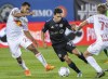 CF Montreal's Joaquin Torres, centre, breaks away New York Red Bulls' Cristian Casseres Jr. (23) and Daniel Edelman during first half MLS soccer action in Montreal on Wednesday, August 31, 2022. THE CANADIAN PRESS/Graham Hughes