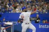 Chicago Cubs right fielder Franmil Reyes (32) hits a home run during fifth inning interleague MLB baseball action against the Toronto Blue Jays, in Toronto on Wednesday, August 31, 2022. THE CANADIAN PRESS/Christopher Katsarov