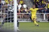 Nashville SC's Randall Leal (8) watches his shot as Colorado Rapids goalkeeper William Yarbrough (22) reaches up to make the block during the second half of an MLS soccer match Wednesday, Aug. 31, 2022, in Nashville, Tenn. (AP Photo/Mark Humphrey)