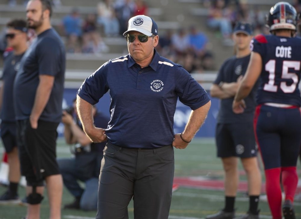 Danny Maciocia the head coach and general manager of the Montreal Alouettes watches his team warm up prior to CFL action against the Edmonton Elks in Montreal on Thursday July 14, 2022. THE CANADIAN PRESS/Peter McCabe