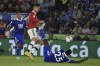Leicester's Wilfred Ndidi, bottom, falls as he tries to stop Manchester United's Cristiano Ronaldo during the English Premier League soccer match between Leicester City and Manchester United at King Power stadium in Leicester, England, Thursday, Sept. 1, 2022. (AP Photo/Rui Vieira)
