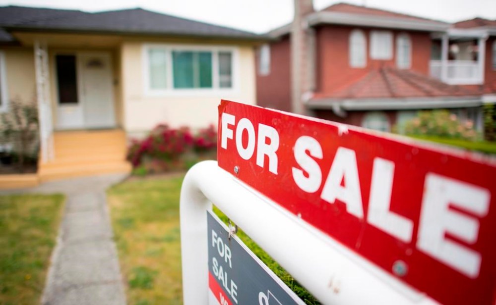 A real estate sign is pictured in Vancouver, B.C., Tuesday, June, 12, 2018. THE CANADIAN PRESS Jonathan Hayward