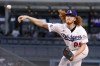 Los Angeles Dodgers starting pitcher Dustin May throws to the plate during the first inning of a baseball against the San Diego Padres game Friday, Sept. 2, 2022, in Los Angeles. (AP Photo/Mark J. Terrill)