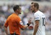 Tottenham's Harry Kane, right, argues with referee Stuart Attwell during the English Premier League soccer match between Tottenham Hotspur and Fulham at Tottenham Hotspur stadium, in London, England, Saturday, Sept. 3, 2022. (AP Photo/Ian Walton)