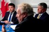 Conservative Leadership candidate Jean Charest, centre, speaks as Roman Baber, left, and Scott Aitchison look on at the Conservative party leadership debate in Ottawa on Wednesday, Aug. 3, 2022. THE CANADIAN PRESS/Adrian Wyld