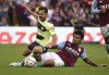 Manchester City's Bernardo Silva, left, challenges for the ball with Aston Villa's Boubacar Kamara during the English Premier League soccer match between Aston Villa and Manchester City at Villa Park in Birmingham, England, Saturday, Sept. 3, 2022. (AP Photo/Rui Vieira)