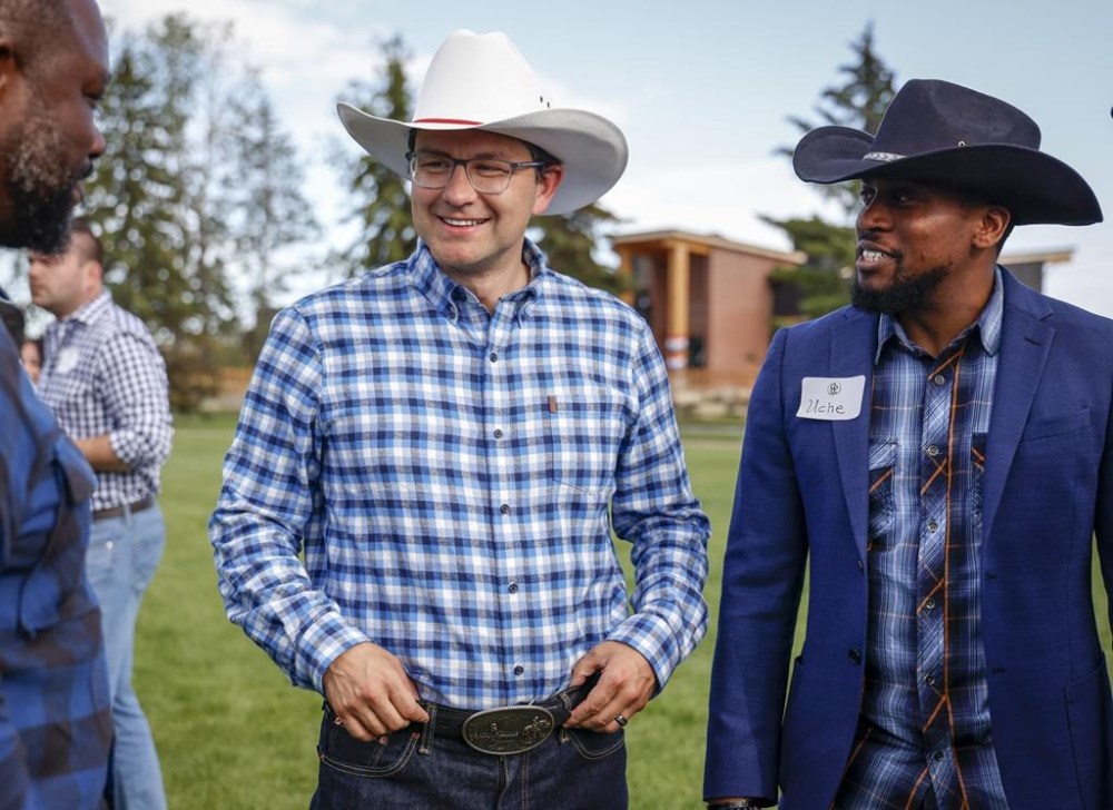 Pierre Poilievre, centre, Conservative party leadership candidate, attends a party barbecue in Calgary, Alta., Saturday, July 9, 2022. THE CANADIAN PRESS/Jeff McIntosh
