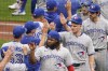 Toronto Blue Jays' Vladimir Guerrero Jr., bottom right, celebrates with teammates after they defeated the Pittsburgh Pirates in a baseball game, Sunday, Sept. 4, 2022, in Pittsburgh. (AP Photo/Keith Srakocic)