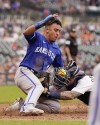 Kansas City Royals' Nicky Lopez is tagged out at home by Detroit Tigers catcher Tucker Barnhart during the eighth inning of a baseball game, Sunday, Sept. 4, 2022, in Detroit. (AP Photo/Carlos Osorio)