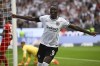 Frankfurt's Randal Kolo Muani celebrates scoring during the German Bundesliga soccer match between Eintracht Frankfurt and RB Leipzig in Frankfurt, Germany, Saturday, Sept. 3, 2022. (Arne Dedert/dpa via AP)