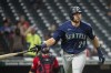 Seattle Mariners' Cal Raleigh watches his two-run home run off Cleveland Guardians relief pitcher Trevor Stephan during the eleventh inning of a baseball game in Cleveland, Sunday, Sept. 4, 2022. (AP Photo/Phil Long)