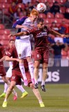 FILE - Real Salt Lake defender Justen Glad, left, and Sacramento Republic FC midfielder Rodrigo Lopez (8) make a header during an exhibition game at Rio Tinto Stadium in Sandy, Utah, Tuesday, Sept. 30, 2014. Rodrigo Lopez was on the field the night Sacramento Republic FC debuted as a franchise nearly a decade ago, filling venerable, old Hughes Stadium to the brim. It was a memorable night and the start of a magical season that ended with a USL championship. (Leah Hogsten/The Salt Lake Tribune via AP, File)