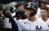 New York Yankees right fielder Aaron Judge (99) celebrates in the dugout after hitting a home run against the Minnesota Twins during the sixth inning of a baseball game Monday, Sept. 5, 2022, in New York. (AP Photo/Noah K. Murray)