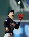 Cleveland Guardians second baseman Andres Gimenez catches a fly ball for the out on Kansas City Royals' Michael A. Taylor during the first inning of a baseball game Monday, Sept. 5, 2022, in Kansas City, Mo. (AP Photo/Charlie Riedel)
