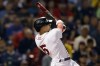Boston Red Sox's Enrique Hernandez follows through on an RBI-double during the fourth inning of a baseball game against the Texas Rangers, Friday, Sept. 2, 2022, in Boston. (AP Photo/Michael Dwyer)