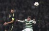 Real Madrid's Karim Benzema, left, challenges for the ball with Celtic's Josip Juranovic during the Champions League Group F soccer match between Celtic and Real Madrid at Celtic park, Glasgow, Scotland, Tuesday, Sept. 6, 2022. (AP Photo/Scott Heppell)