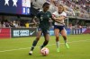 Nigeria's Blessing Demehin, left, controls the ball as United States' Sofia Huerta defends during the first half of an international friendly soccer match Tuesday, Sept. 6, 2022, in Washington. (AP Photo/Julio Cortez)