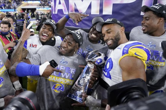 Los Angeles Rams players celebrate with the Lombardi Trophy after defeating the Cincinnati Bengals in the NFL Super Bowl on Feb. 13. (Mark J. Terrill / The Associated Press files)