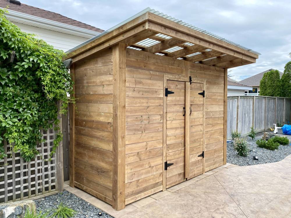 Marc LaBossiere / Winnipeg Free Press
The shed boasts 6x6 corner posts, decorative horizontal sheathing, French doors and a semi-clear corrugated sloped roof.