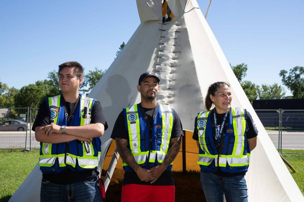 JESSICA LEE / WINNIPEG FREE PRESS
From left to right: Dylan Olson, Daniel Hidalgo and Janet Anderson of SABE Peace Walkers at their base on the edge of the Exchange District.
