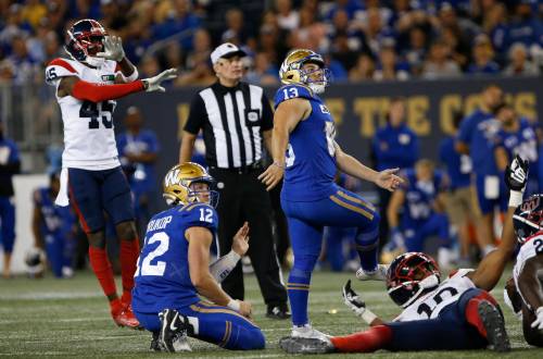 JOHN WOODS / THE CANADIAN PRESS Montreal Alouettes defensive back Kenneth Durden (45) reacts as kicker Marc Liegghio (13) watches his field goal attempt go wide during overtime.