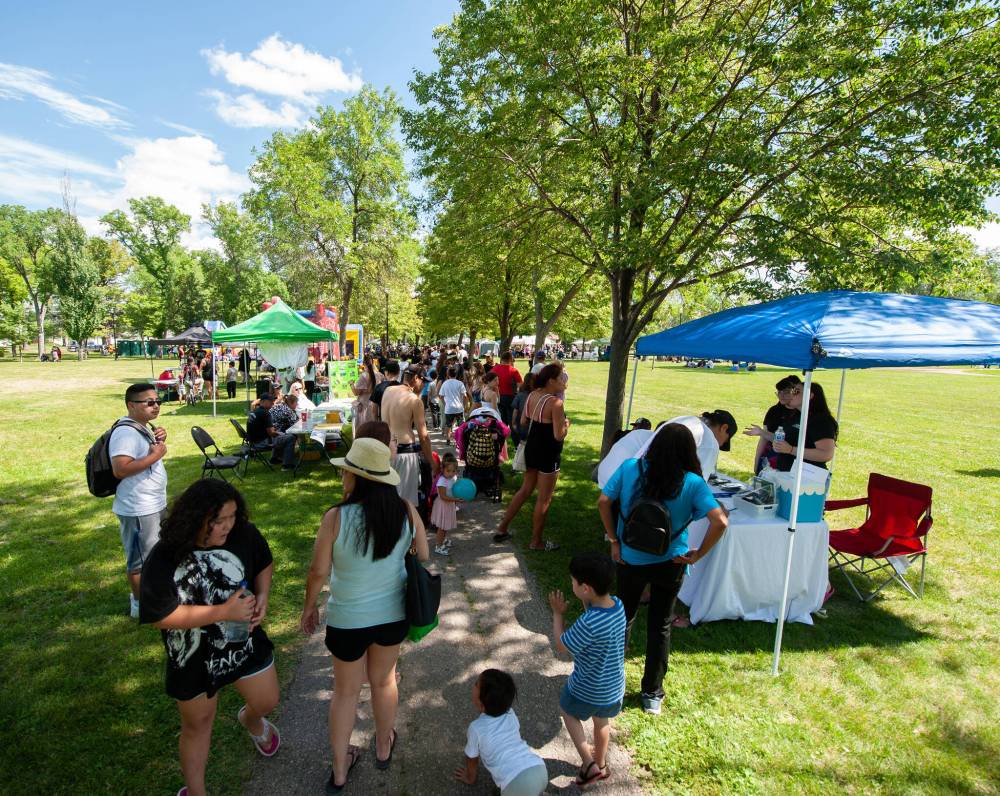 People line up for kids activities and snacks. (Ethan Cairns / Winnipeg Free Press)