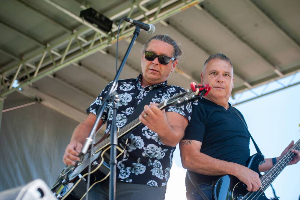 Jay Bodner, left, and Lawrence (Spatch) Mulhall of Indian City perform at the 14th annual No Stone Unturned concert in St John's Park to honour Manitoba's missing and murdered Saturday. (Ethan Cairns / Winnipeg Free Press)