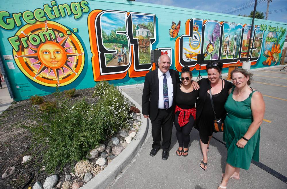 Tom Ethans (from left), executive director of Take Pride Winnipeg, artist Morgan Biggs, artist Jen Mosienko and Kristi Meek, president of the Assiniboia Chamber of Commerce. (John Woods / Winnipeg Free Press)