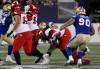 Shayne Gauthier takes down Stampeders QB Jake Maier for a crucial sack late in Thursday’s game at IG Field. (John Woods / The Canadian Press)