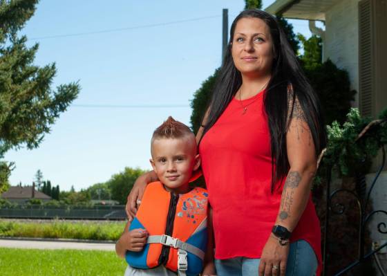 Karly Mooney and her son Kane, 6, have had a hard time being able to book swimming lessons. (Ethan Cairns / Winnipeg Free Press)
