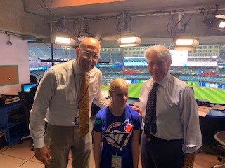 Madison Martin met her broadcasting heroes, Dan Shulman (left) and Buck Martinez (right), at Rogers Centre earlier this week.  (Supplied)