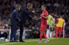 Brighton and Hove Albion manager Graham Potter speaks to Leandro Trossard during the English Premier League soccer match between Fulham and Brighton at Craven Cottage, London, Tuesday Aug. 30, 2022. (John Walton/PA via AP)