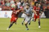 Toronto FC forward Ayo Akinola (20) and CF Montreal defender Rudy Camacho (4) battle for the ball during first half MLS soccer action in Toronto on Sunday, Sept. 4, 2022. On Sunday evening, CF Montreal put together a momentous first-half comeback in the Canadian Classique on their way to a 4-3 win over Toronto FC. THE CANADIAN PRESS/Cole Burston