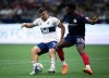 Vancouver Whitecaps' Lucas Cavallini (9) and Chicago Fire's Carlos Teran (23) vie for the ball during the second half of an MLS soccer game in Vancouver, on Saturday, July 23, 2022.&nbsp;The Vancouver Whitecaps will be without their leading scorer for the rest of September after Major League Soccer's disciplinary committee handed Cavallini a four-game suspension Thursday. THE CANADIAN PRESS/Darryl Dyck