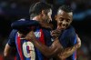 Barcelona's Robert Lewandowski, left, celebrates with teammates after scoring his side's fourth goal during a Group C Champions League soccer match between FC Barcelona and Viktoria Plzen at the Camp Nou stadium in Barcelona, Spain, Wednesday, Sept. 7, 2022. (AP Photo/Joan Monfort)