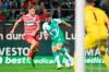 Werder's Niclas F'llkrug, right, and Augsburg's Florian Niederlechner fight for the ball during the Bundesliga soccer match between Werder Bremen and FC Augsburg, in Bremen, Germany, Friday Sept. 9, 2022. (Carmen Jaspersen/dpa via AP)
