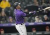 Colorado Rockies' C.J. Cron flies out against Arizona Diamondbacks relief pitcher Caleb Smith in the eighth inning of a baseball game Friday, Sept. 9, 2022, in Denver. (AP Photo/David Zalubowski)