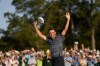 FILE - Scottie Scheffler celebrates after winning the 86th Masters golf tournament on April 10, 2022, in Augusta, Ga. Scheffler was announced Saturday as the PGA Tour player of the year. (AP Photo/Matt Slocum, file)