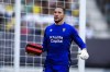 Cadiz's goalkeeper Jeremias Ledesma brings a defibrillator as a supporter is attended by a medical team at the stand during Spanish la Liga soccer match between Cadiz FC and FC Barcelona at the Nuevo Mirandilla stadium in Cadiz, southern Spain, Saturday, Sept. 10, 2022. (AP Photo/Jose Breton)